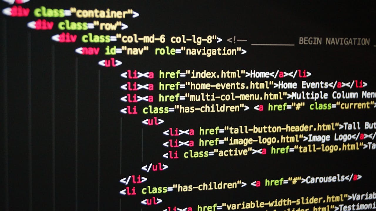 Close-up of vibrant HTML code displayed on a computer screen, showcasing web development and programming.